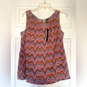 New sleeveless. Size L. Multicolor in purple orange and brown.  Gold accent